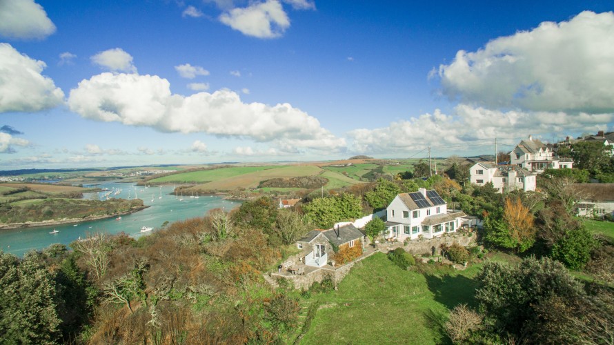 Nestled on the hillside as its name suggests over the estuary from Salcombe